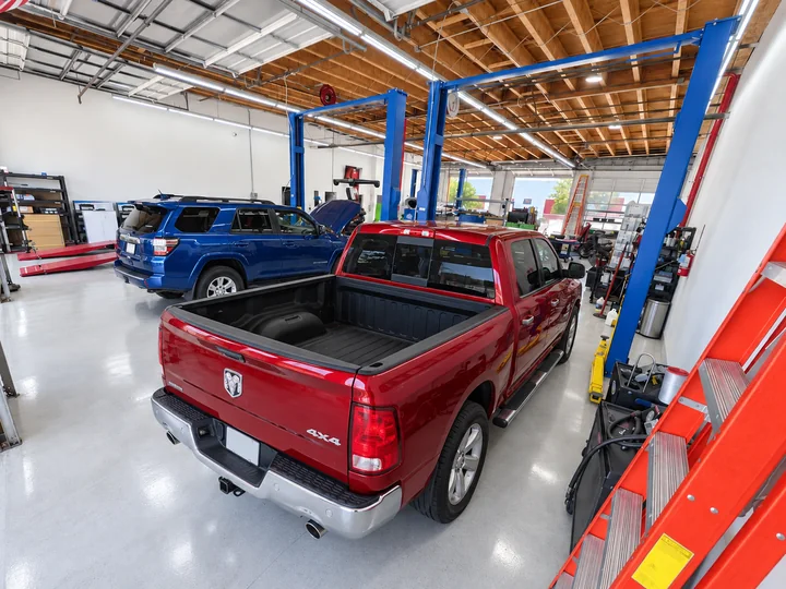 A pickup truck in a service bay at Super Service of Corona Hills